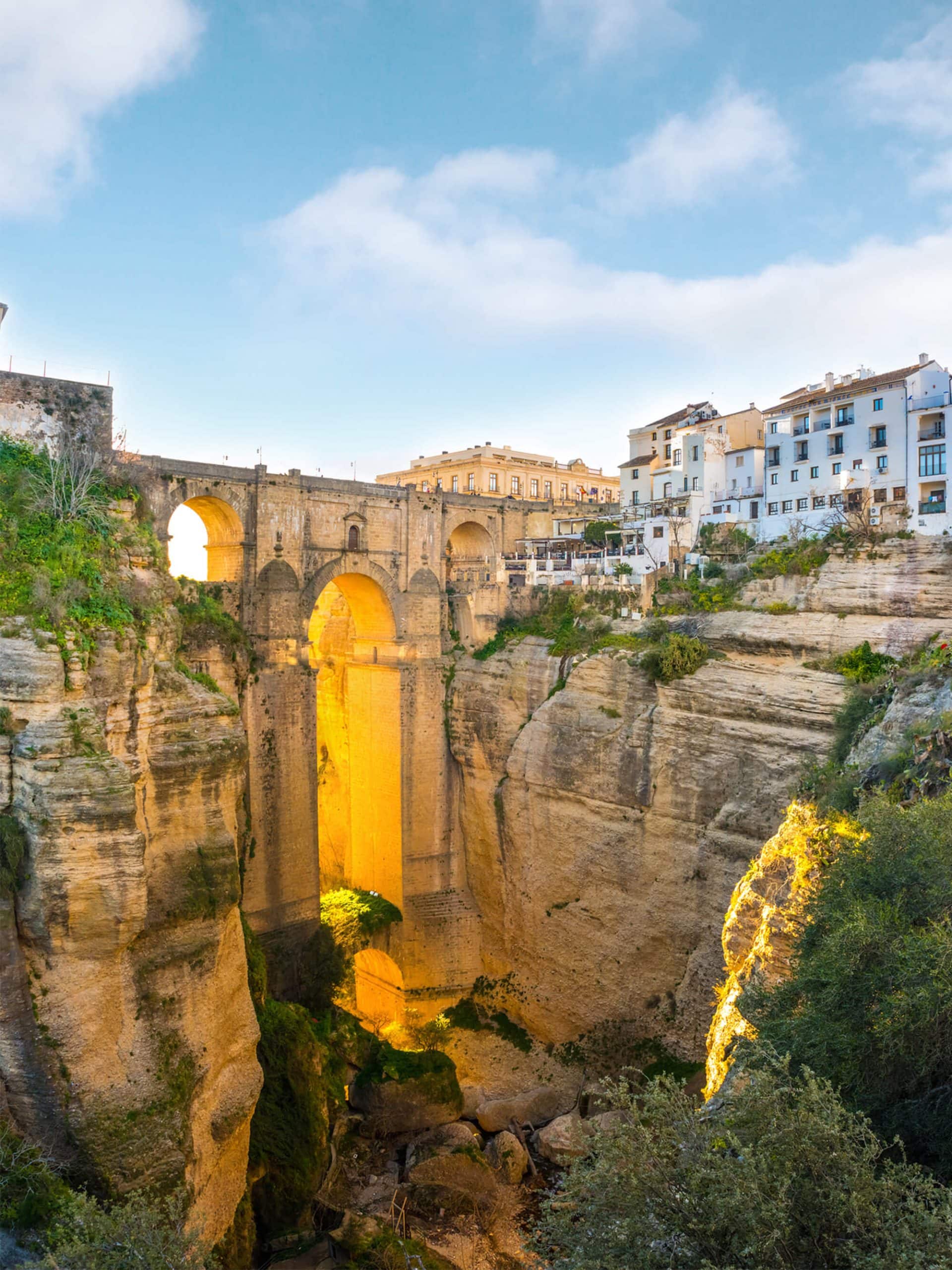 View om the impressive Puente Nuevo Bridge in Ronda, Spain at sunset