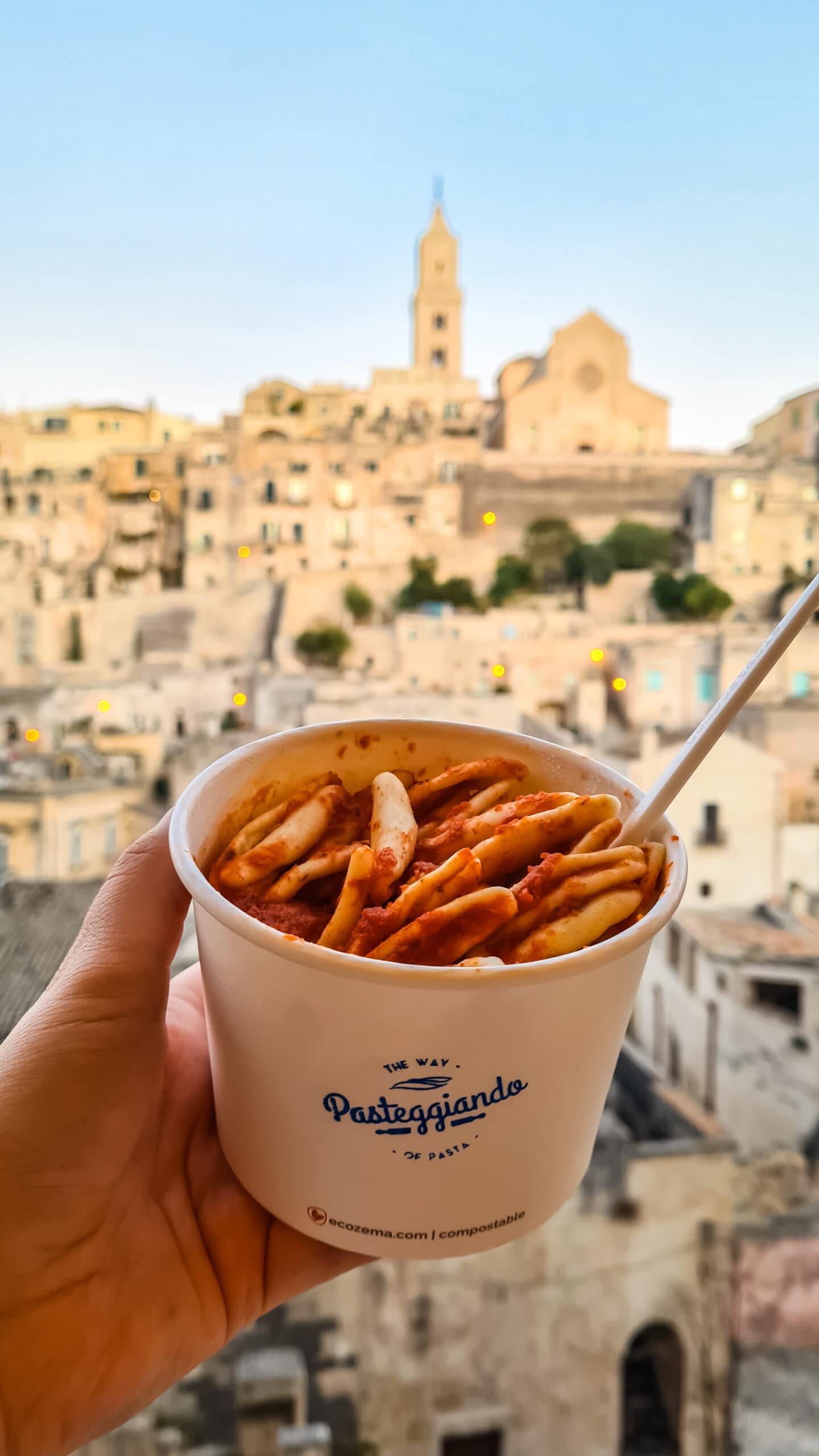 Takeaway pasta in front of the best hotel view in Matera Italy