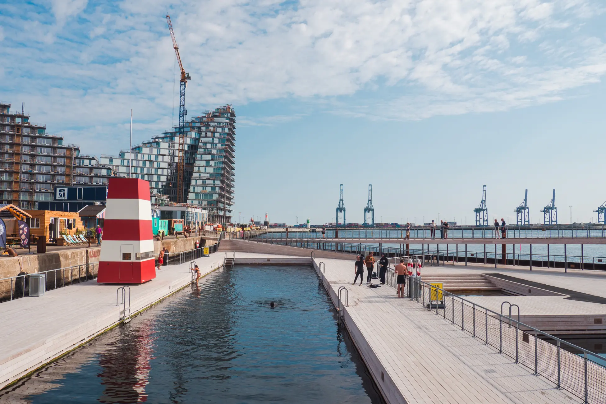 Lap pool by the ocean with highrises in the background, one of the top things to do in Aarhus Denmark.