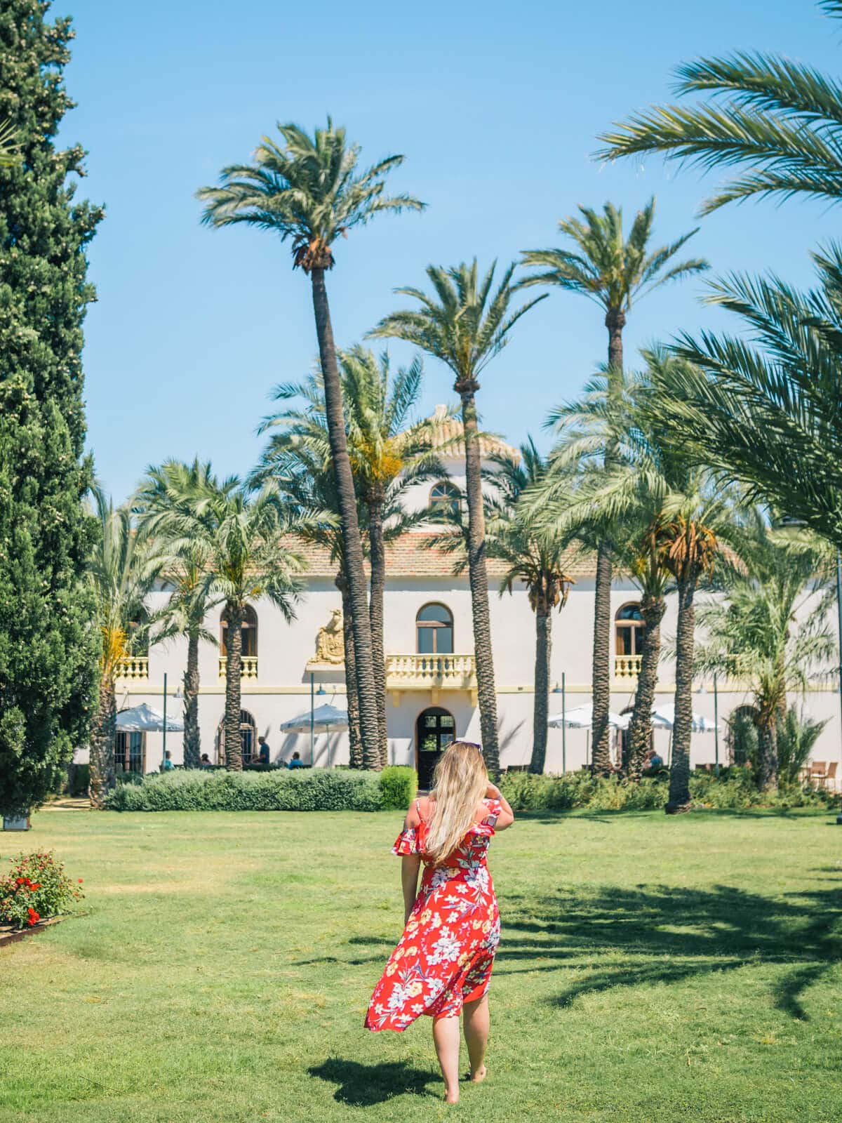 The stunning pal tree garden and old hacienda at Riquelme Golf Resort