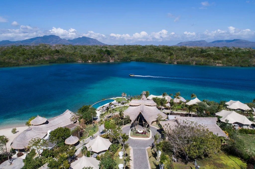 Aerial view of the villas and bungalows at Menjangan Dynasty Resort set next to the blue ocean, one of the top things to do in West Bali.