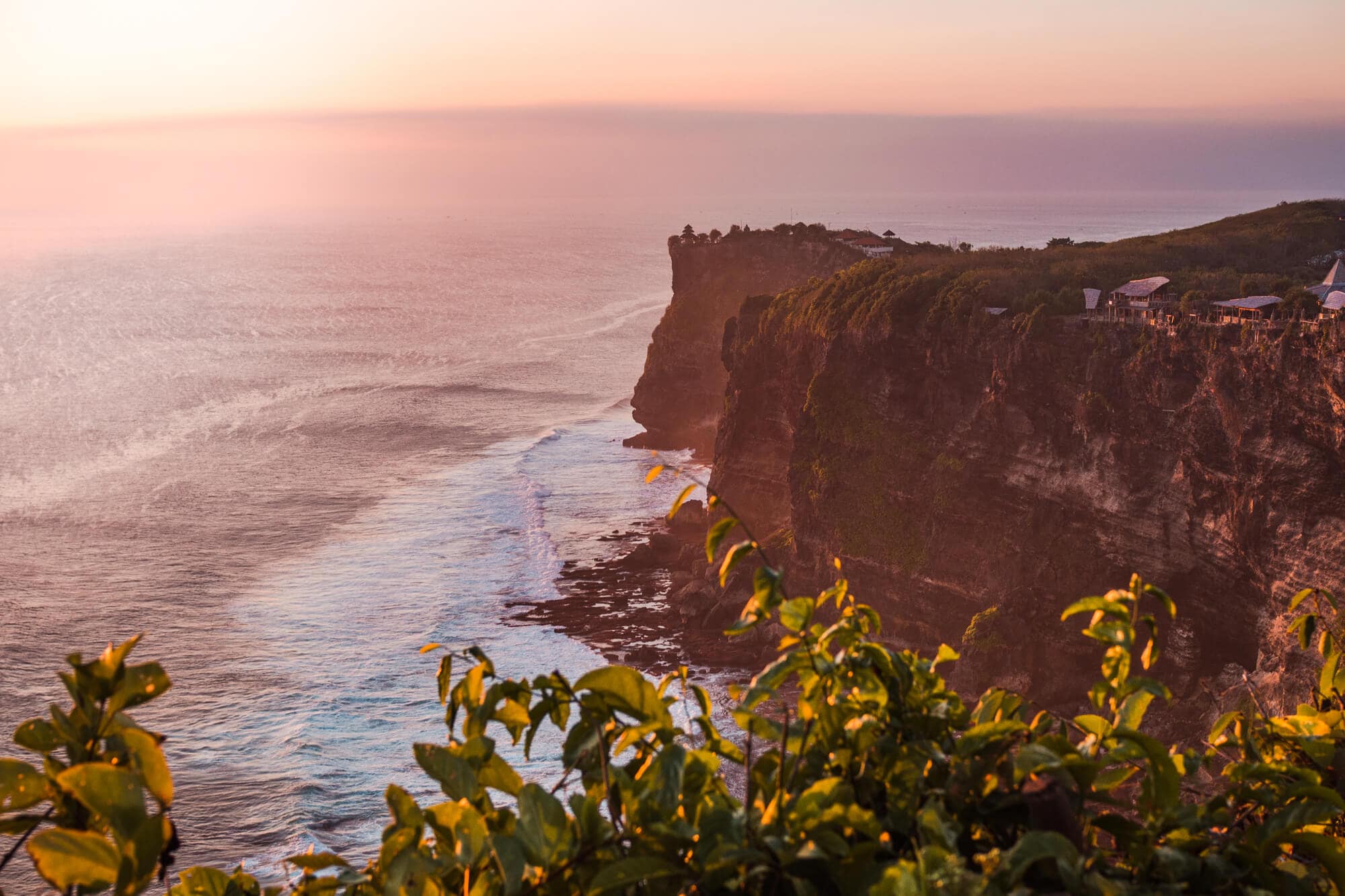 View of the Uluwatu Cliffs from Karang Boma Cliff viewpoint at sunset in Bali