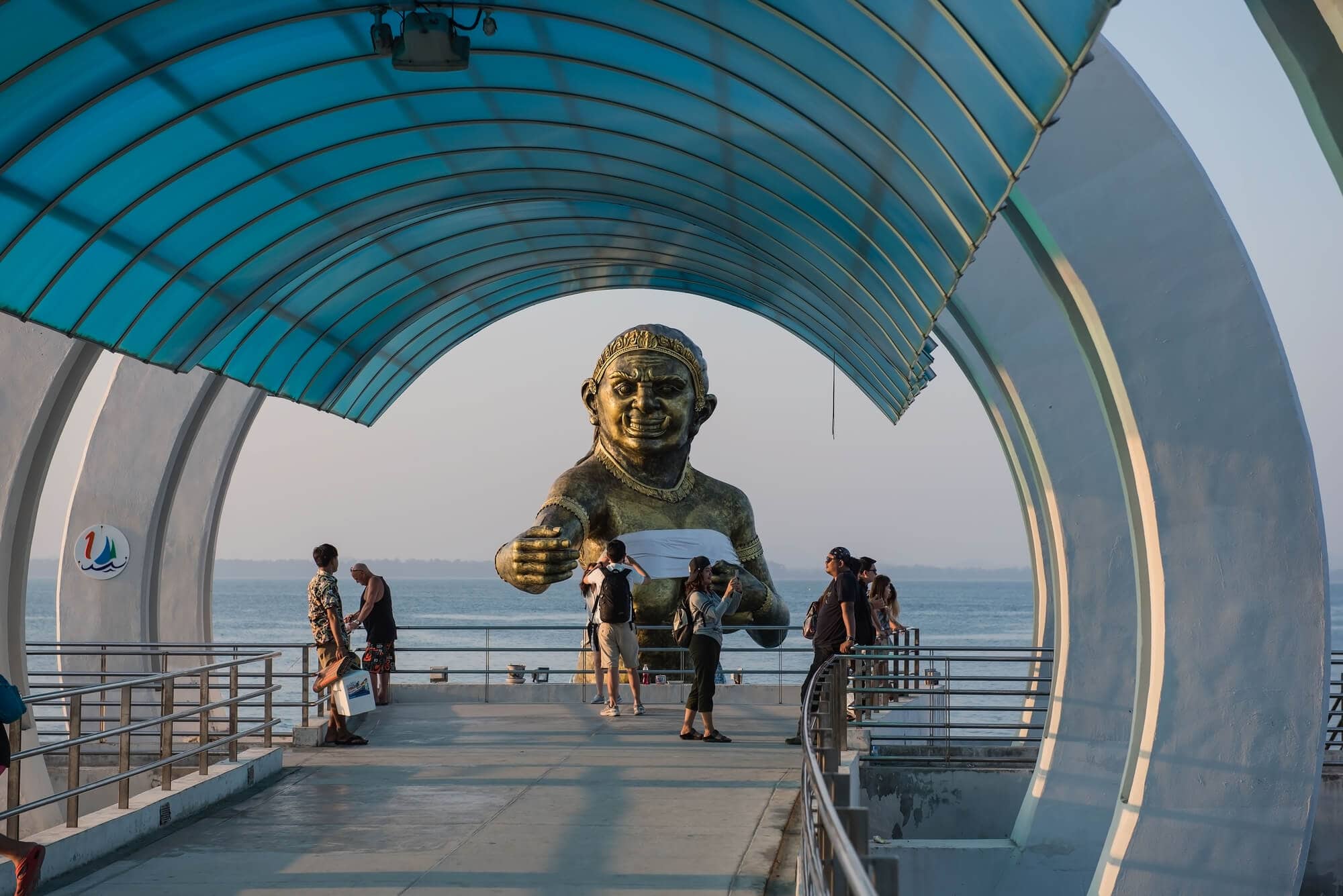 View of Koh Samet Pier with its large mermaid statue rising up from the water.