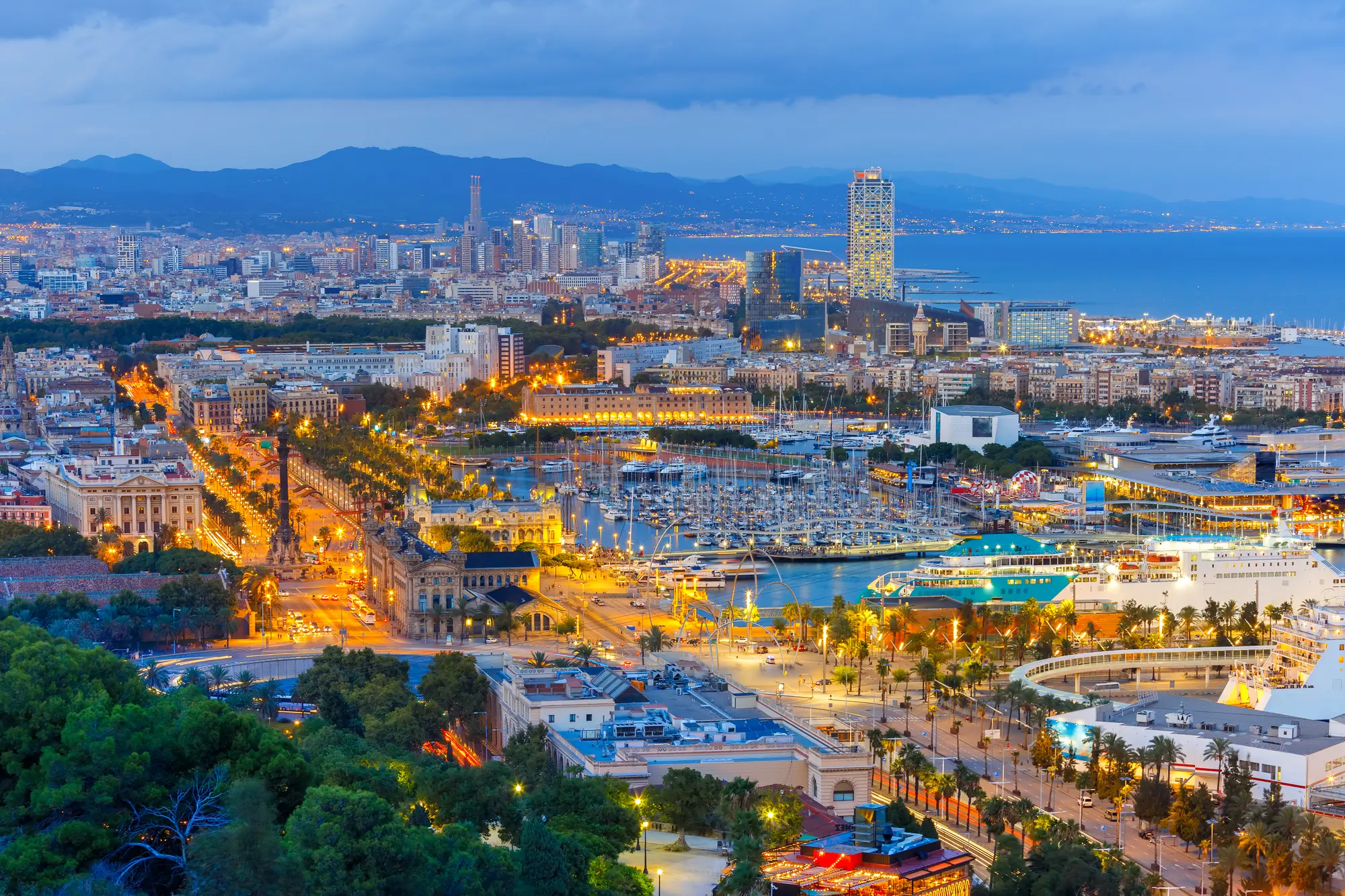 View of Port Vell and Barcelona Cruise Port at dusk.