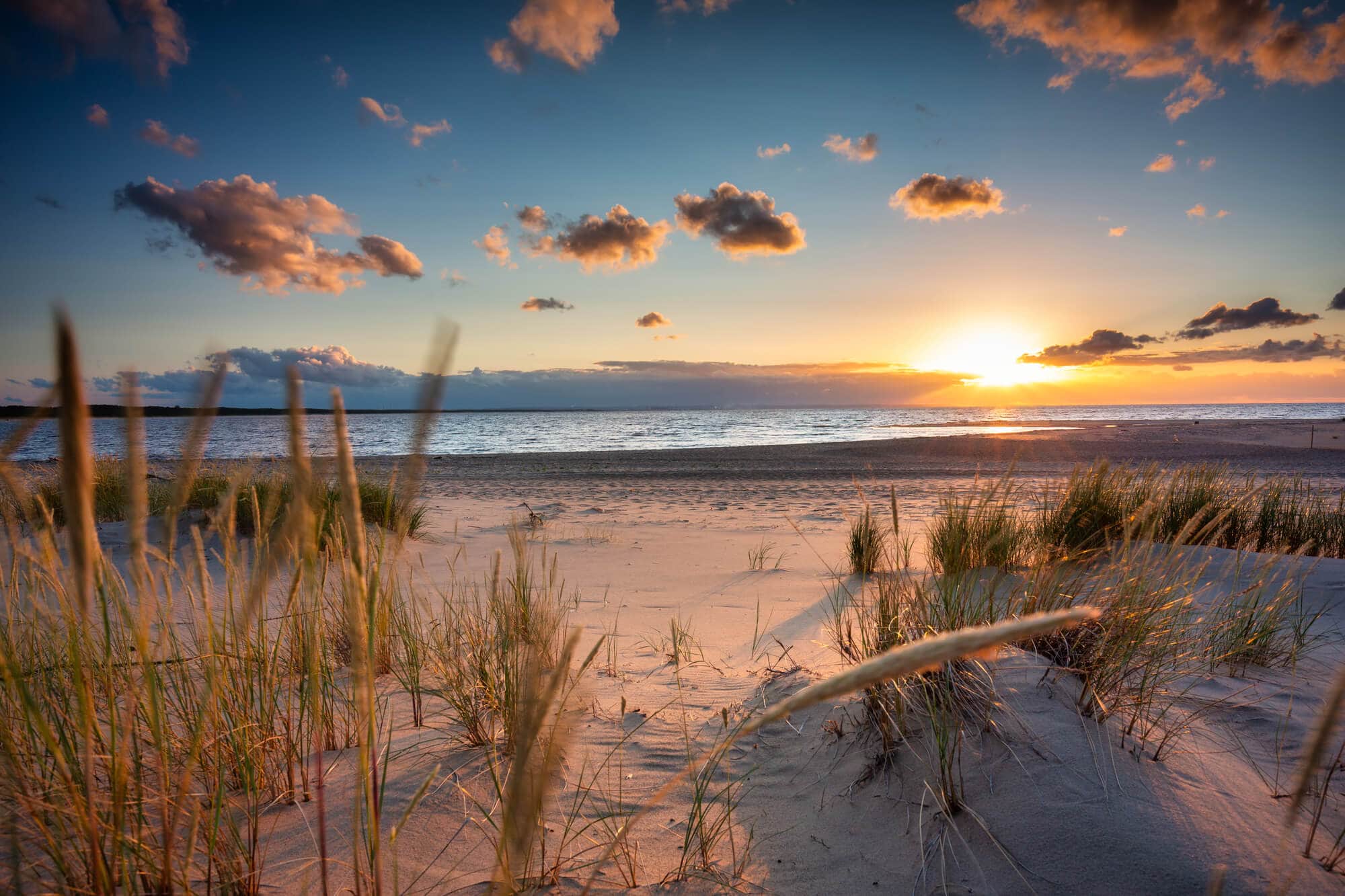Sunset over a beach on Sobieszewo Island, the perfect day trip from Gdansk