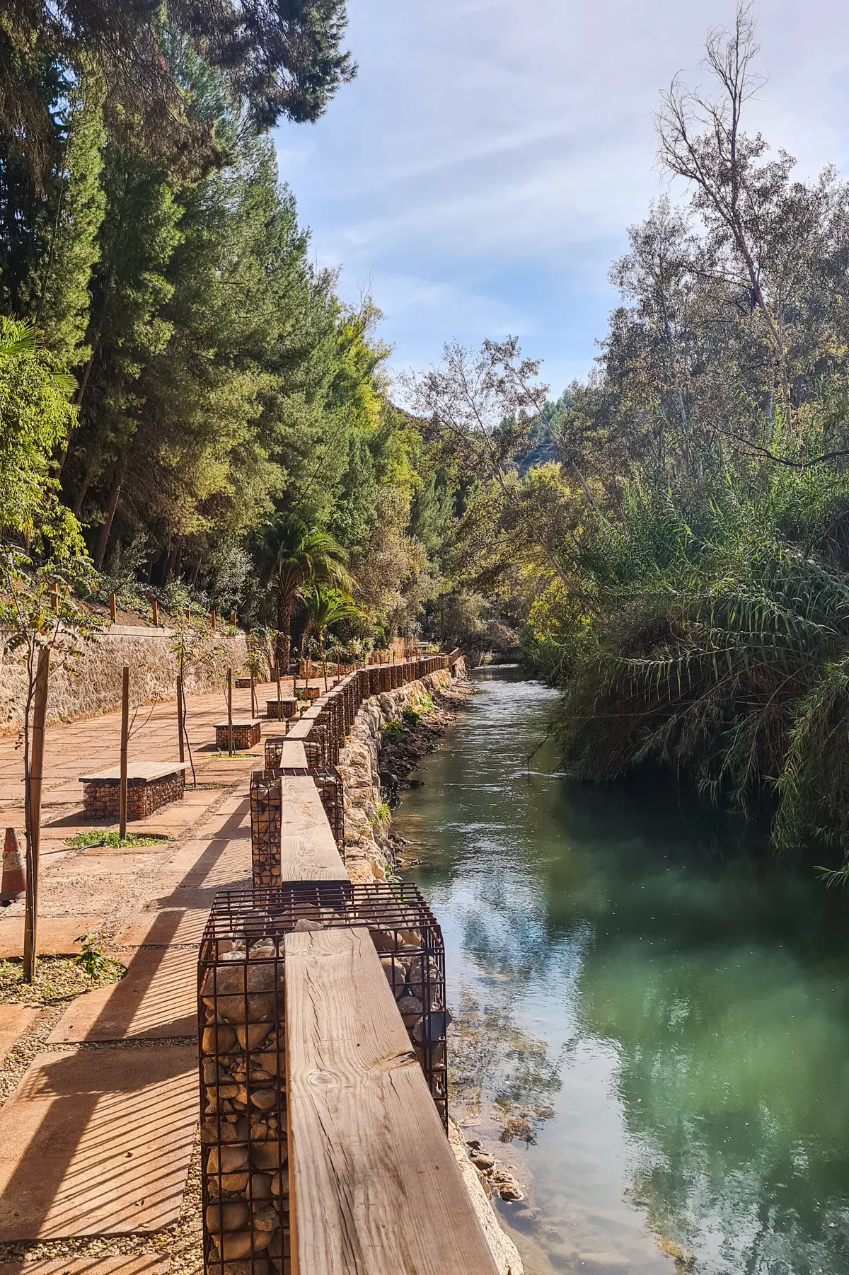 Walkway along the green Segura River at Santuario Nuestra Señora de la Esperanza, one of the top things to do in Murcia.