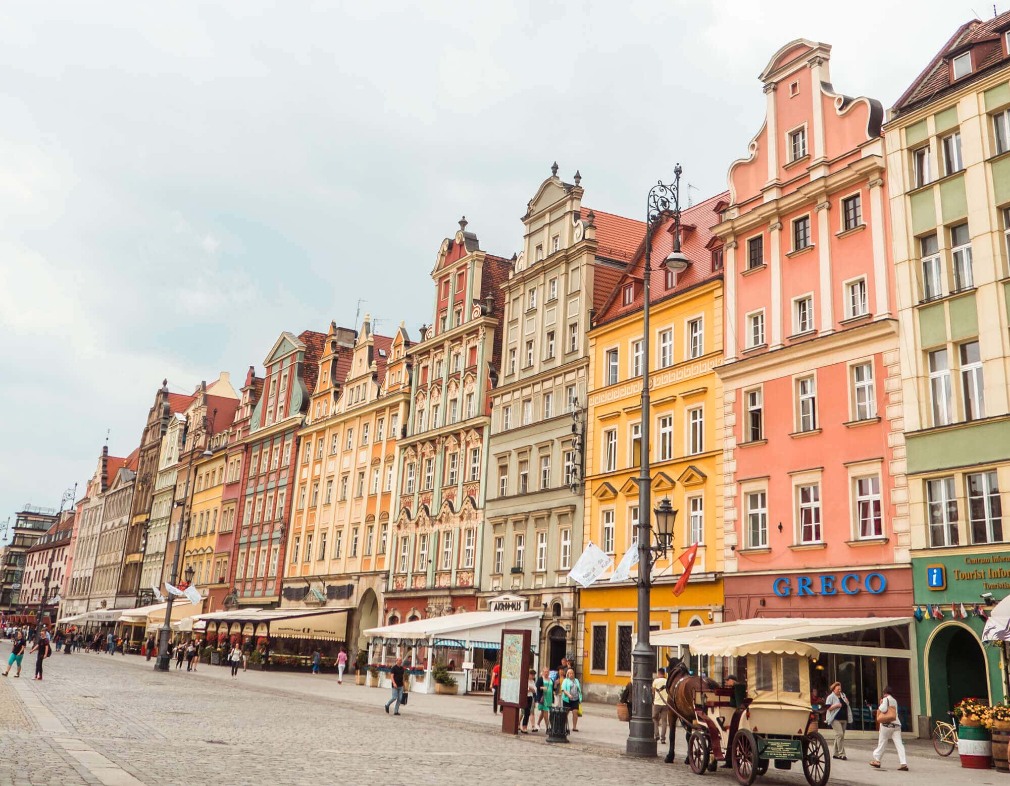 A row of colorful town houses along the main square in Wroclaw, one of the reasons to visit Poland.