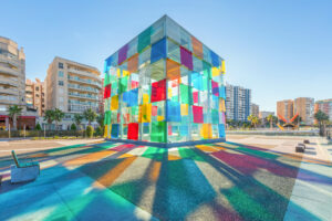 Light reflecting the colors of the glass cube on top of Centro Pompidou, close to the cruise port in Malaga Spain.