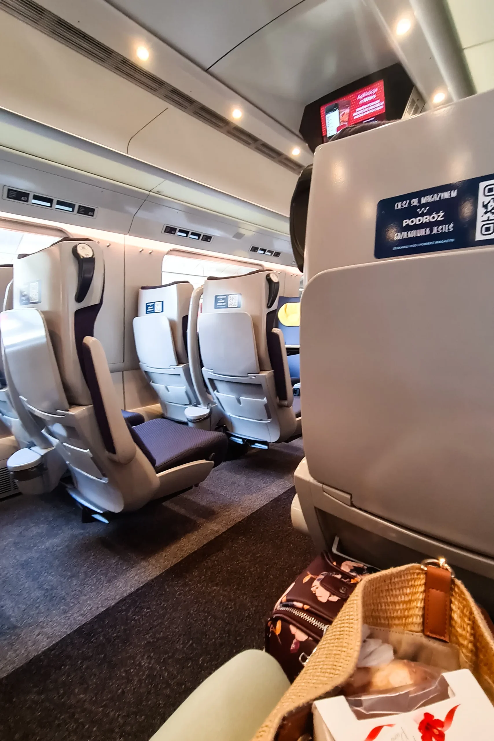 Comfortable seats inside a first-class train from Krakow to Gdansk in Poland.