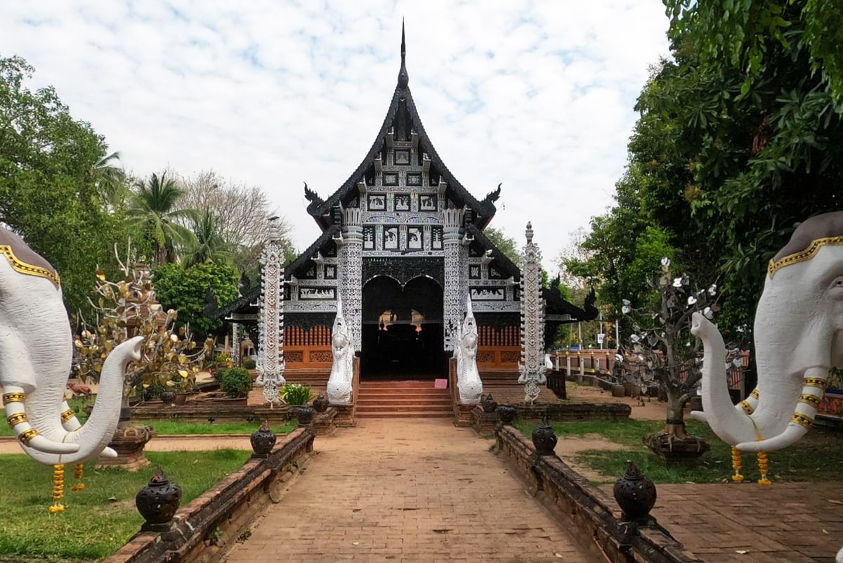 The entrance to Wat Look Moli, with a white elephant on both sides, one of the best temples in Chiang Mai, Thailand.