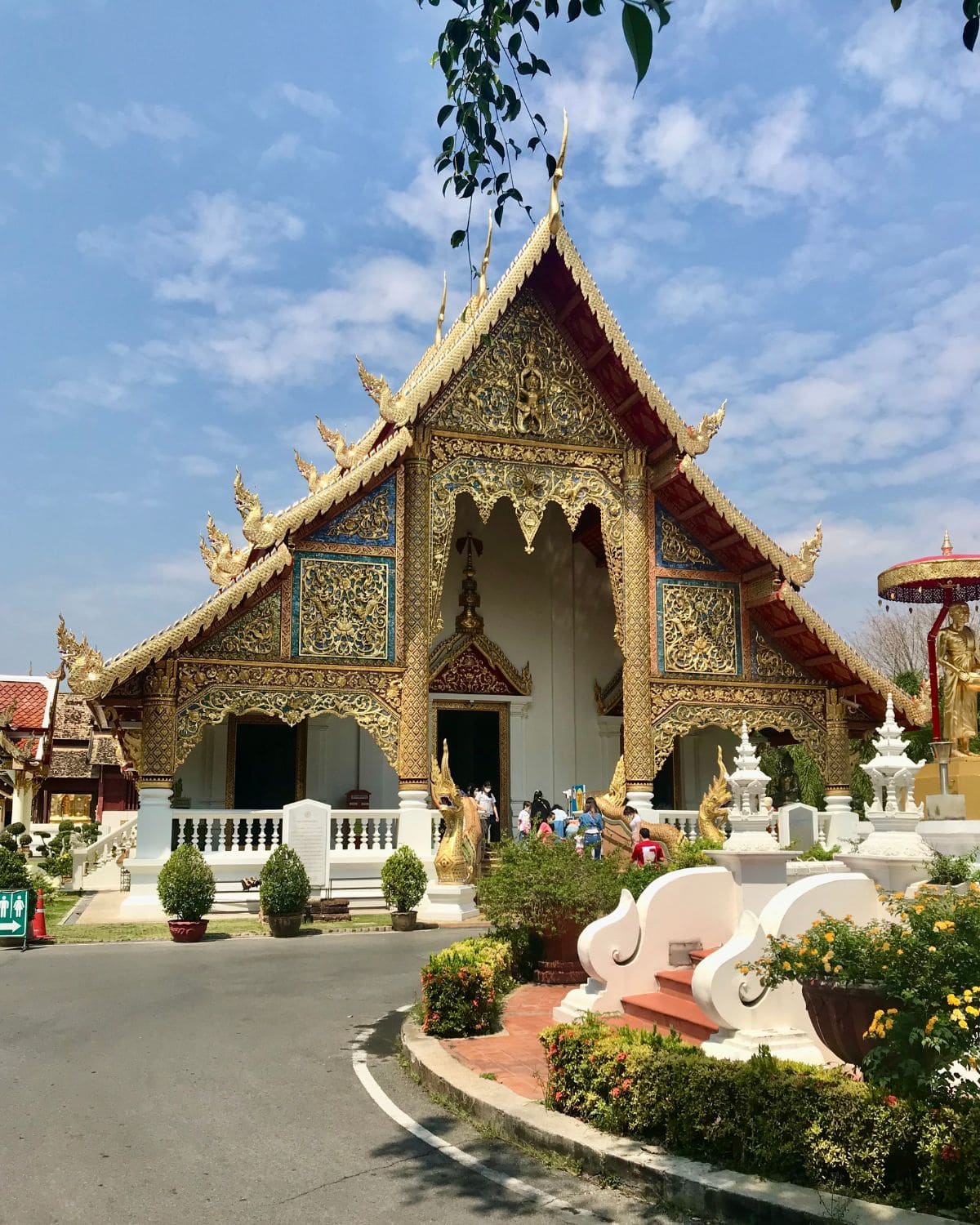 Intricately detailed gold temple building inside Wat Phra Singh temple in Chiang Mai, Thailand.