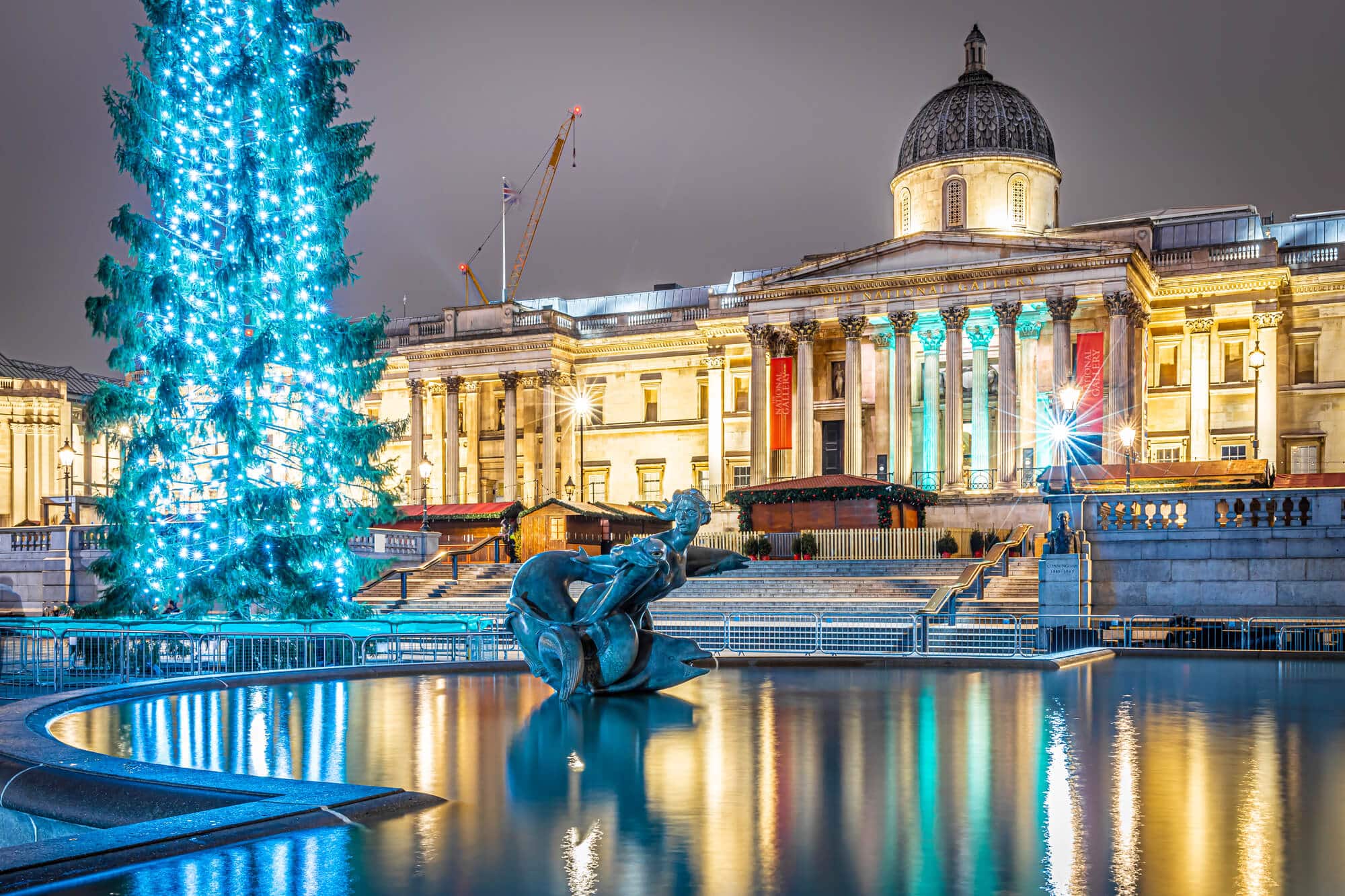 Trafalgar Square in London and a large Christmas tree with lights on, a gift from Norway.