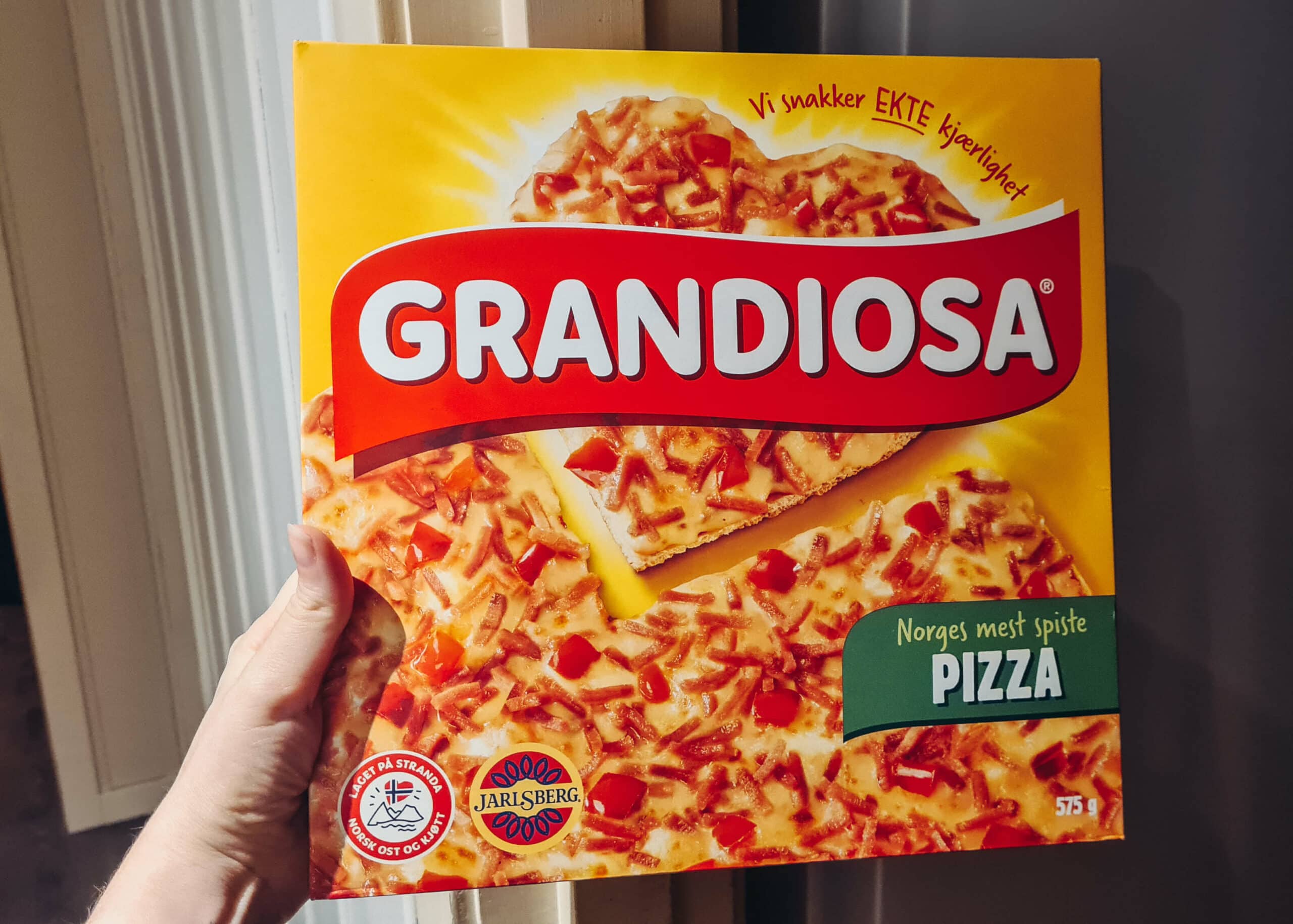 Fun fact, Norwegians love Grandiosa from this orange Grandiosa frozen pizza carton.