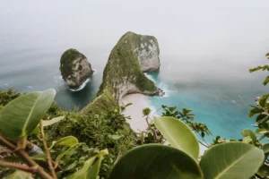 View from above of the T-Rex shaped cliff and white sand at Kelingking Beach, one of the top things to see in West Nusa Penida.