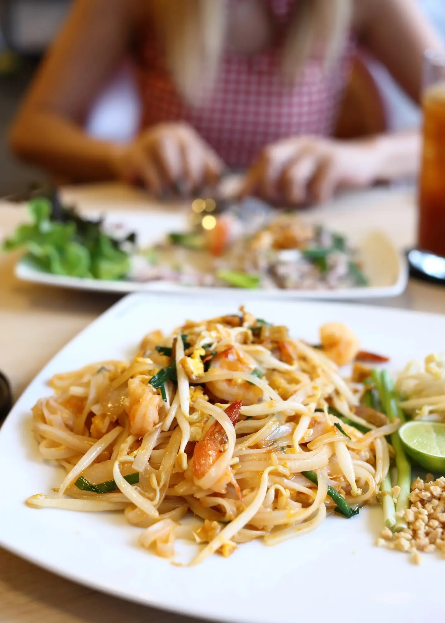 White plate with Pad Thai  - Indonesia vs. Thailand food