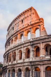 Close up of one side of the Colosseum glowing in the sunset. Is Rome safe?