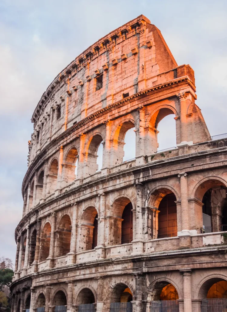 Close up of one side of the Colosseum glowing in the sunset. Is Rome safe?