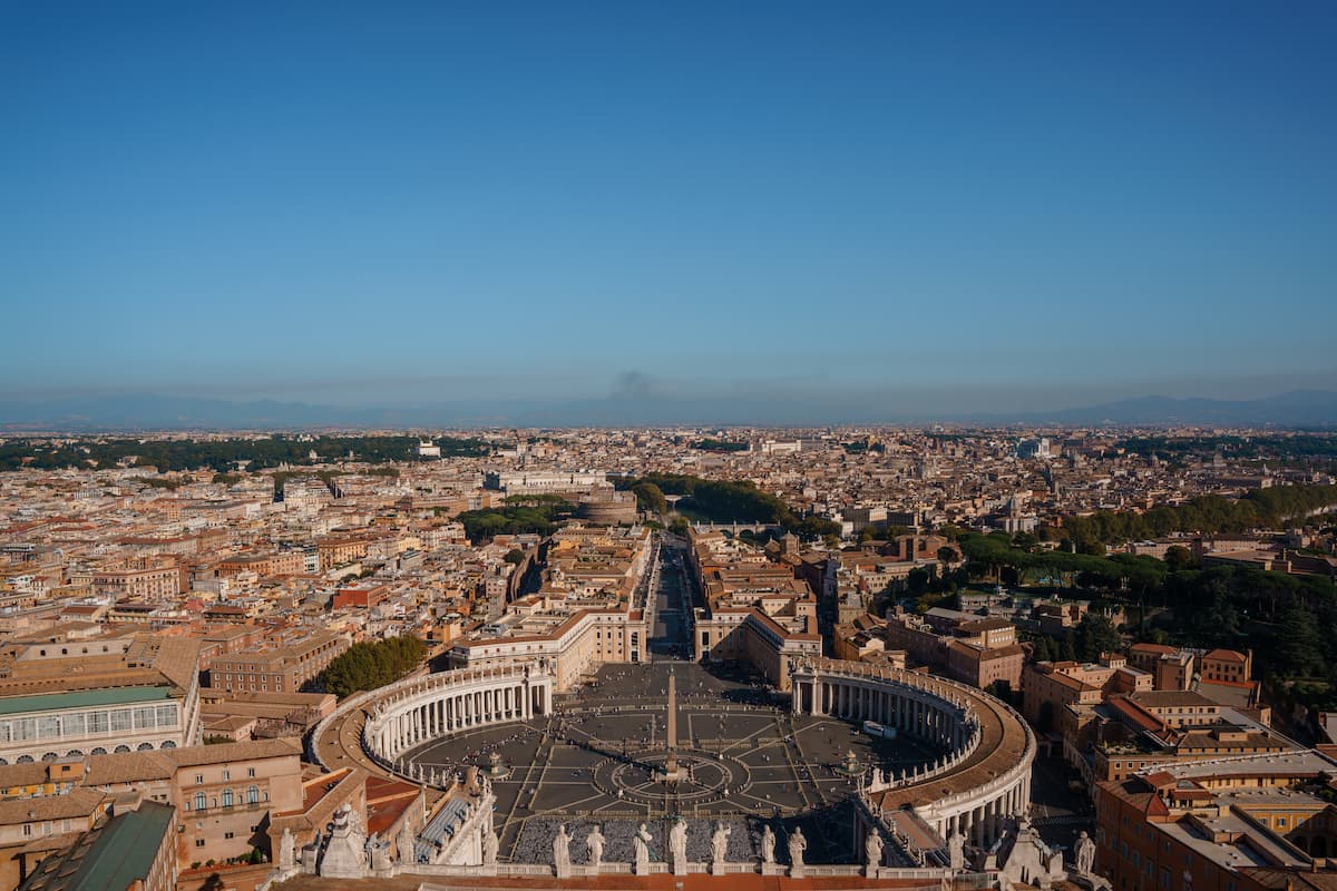 Aerial view of the Vatican City in Rome set against a blue sky. Is Rome safe?