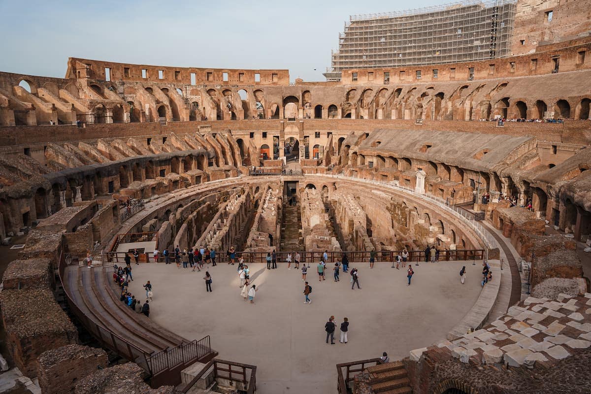 People walking inside the Colosseum ruins in Rome, Safety in Rome.