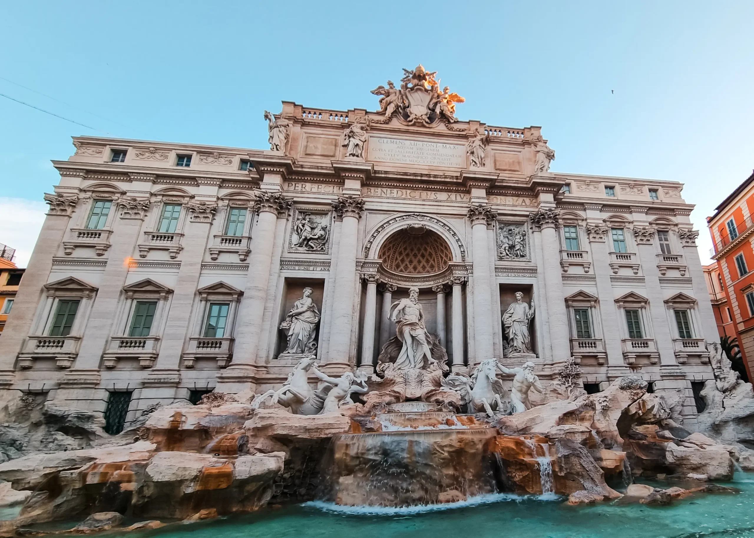 Close up view of the majestic Trevi Fountain in Rome, early on a sunny day. Safety in Rome.