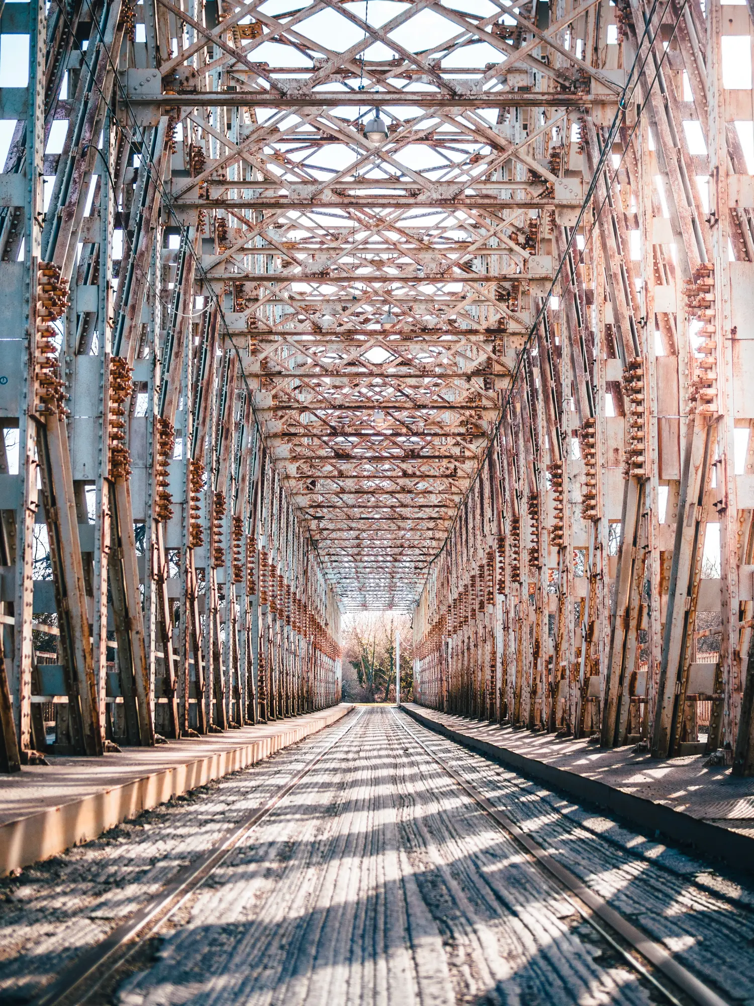 Industrial metal K-Bridge bridge leading to Obuda Island, a hidden gem in Budapest.