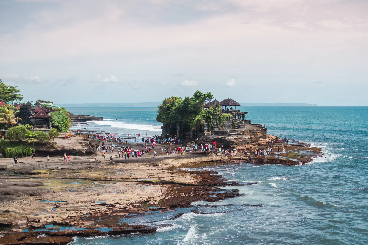 View of Tanah Lot Temple on a Rock surrounded by water in Canggu, Bali or Lombok?