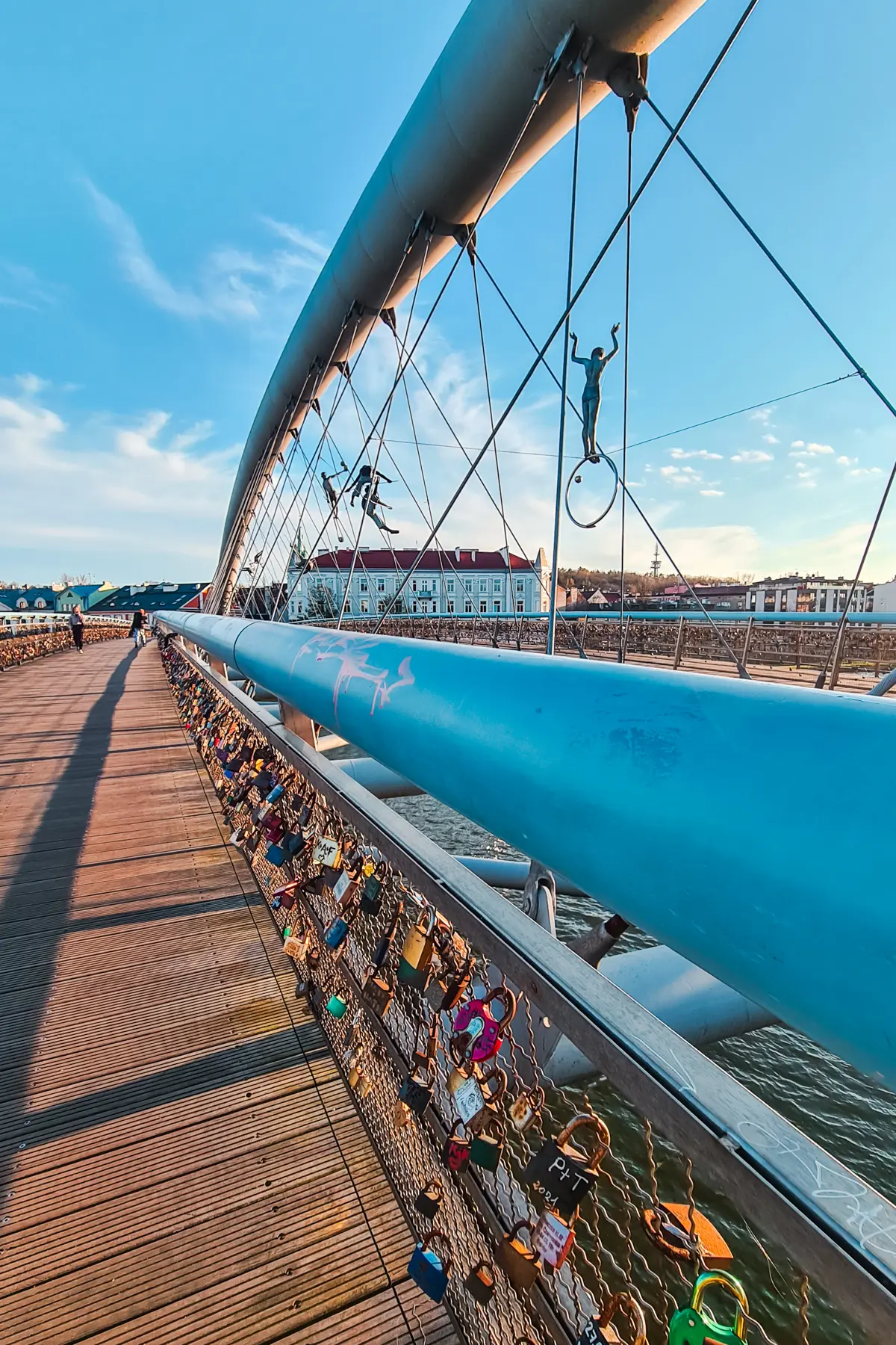 Close up of the blue balustrade at Father Bernatek’s Bridge with love locks in Kazimierz, Krakow.