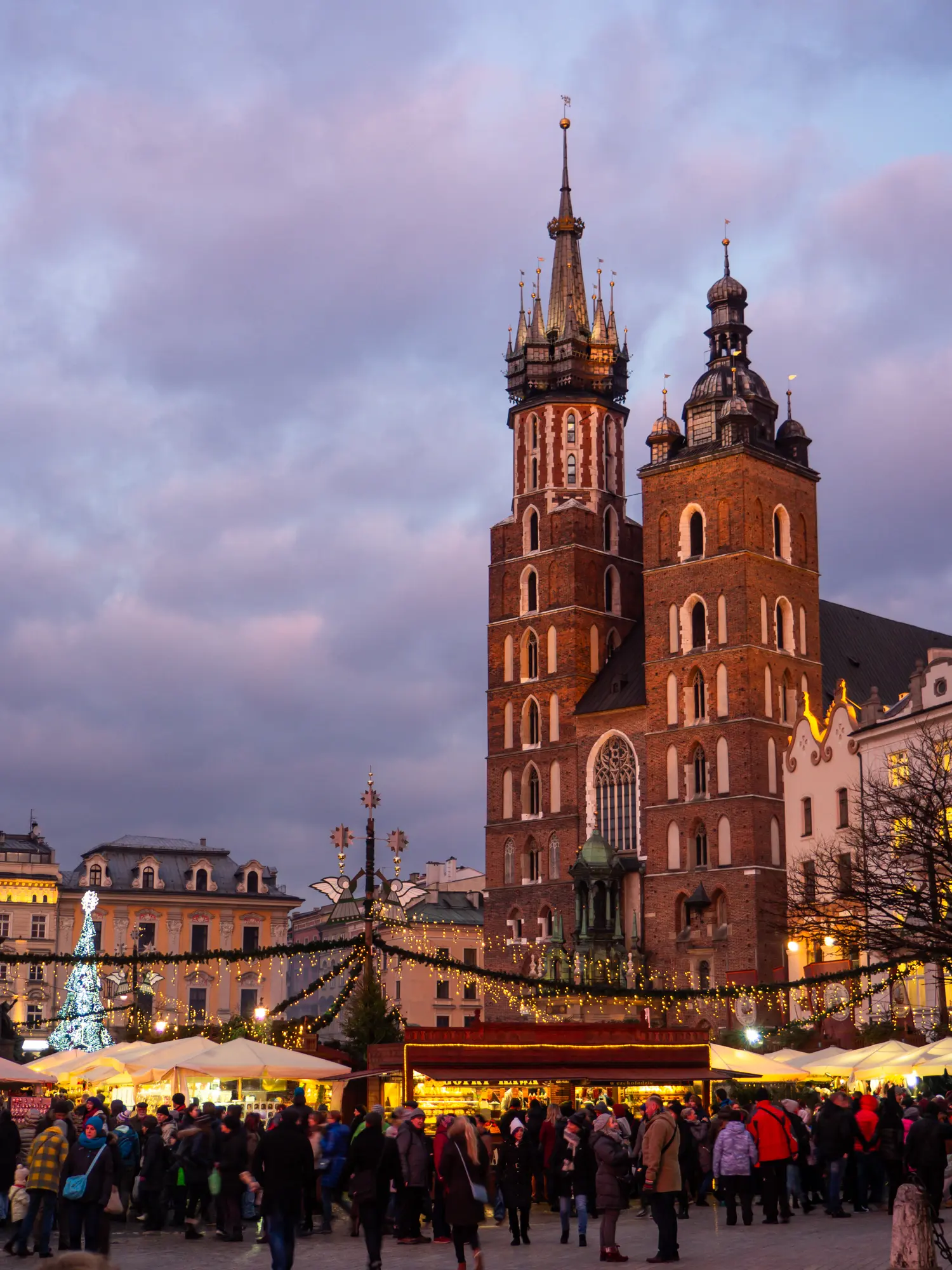 Krakow Christmas Market at Rynek Market Square in front of St.Mary's Basilica, at dusk, the best time to visit.