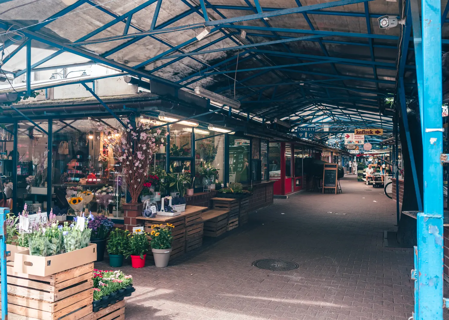 An alley with a flower shop in the covered Stary Kleparz market, a hidden gem in Krakow.