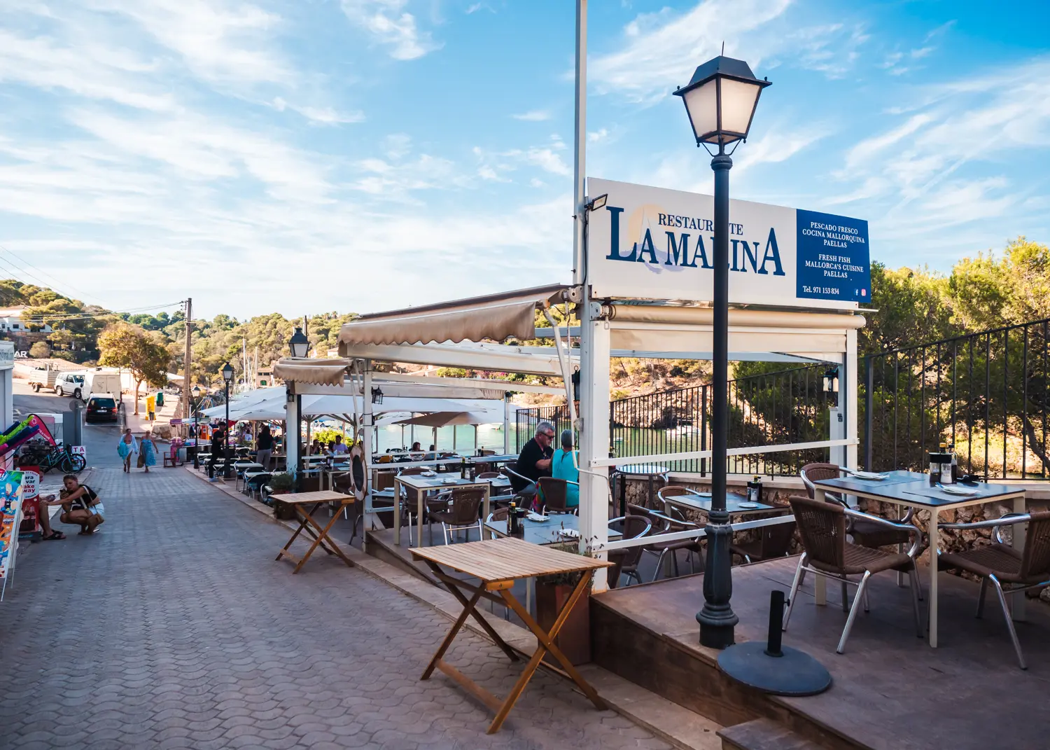 La Marina Restaurant outdoor seating along the waterfront in Cala Figuera.