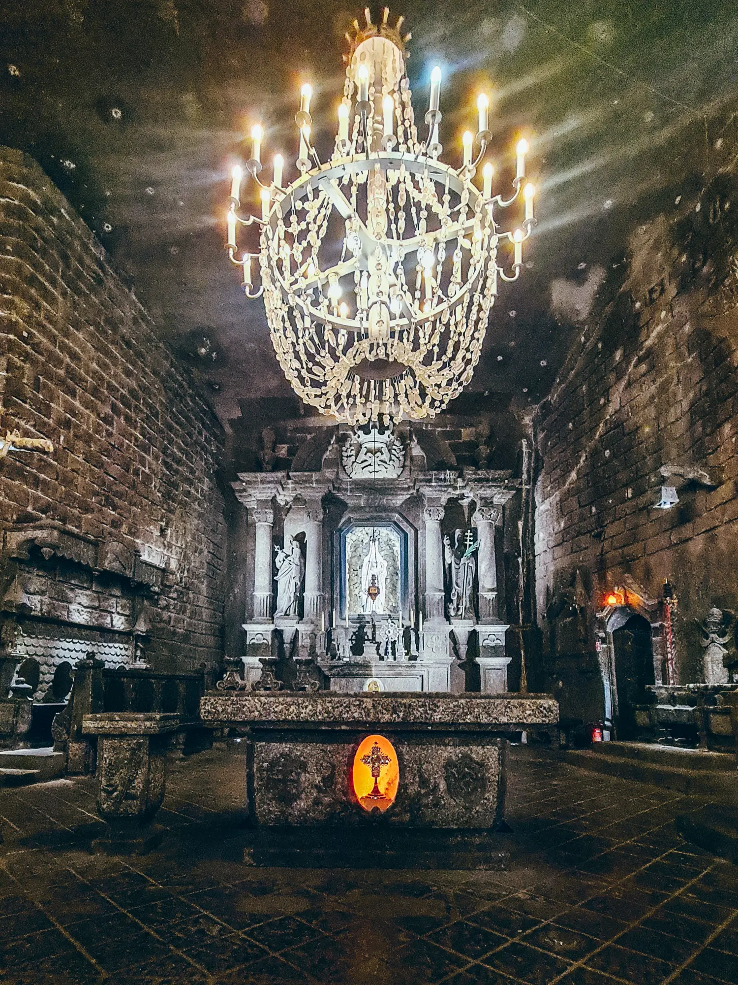 Altar and a huge chandelier made from salt in St. Kinga's Chapel Wieliczka Salt Mine in Krakow.