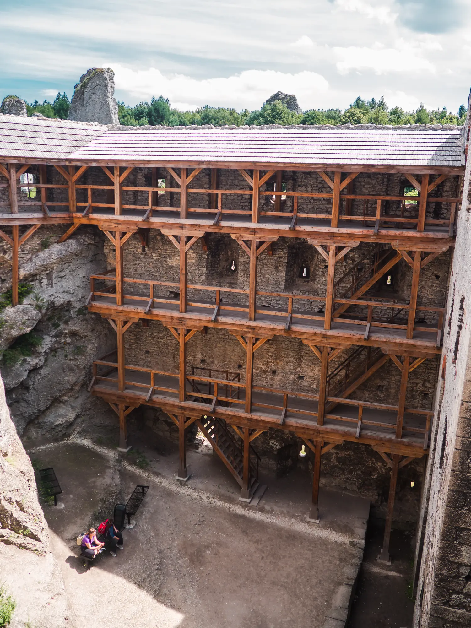3 floors of wooden walkways inside Ogrodzieniec Castle ruin on a sunny day, on the Trail of the Eagles Nests close to Krakow in Poland.