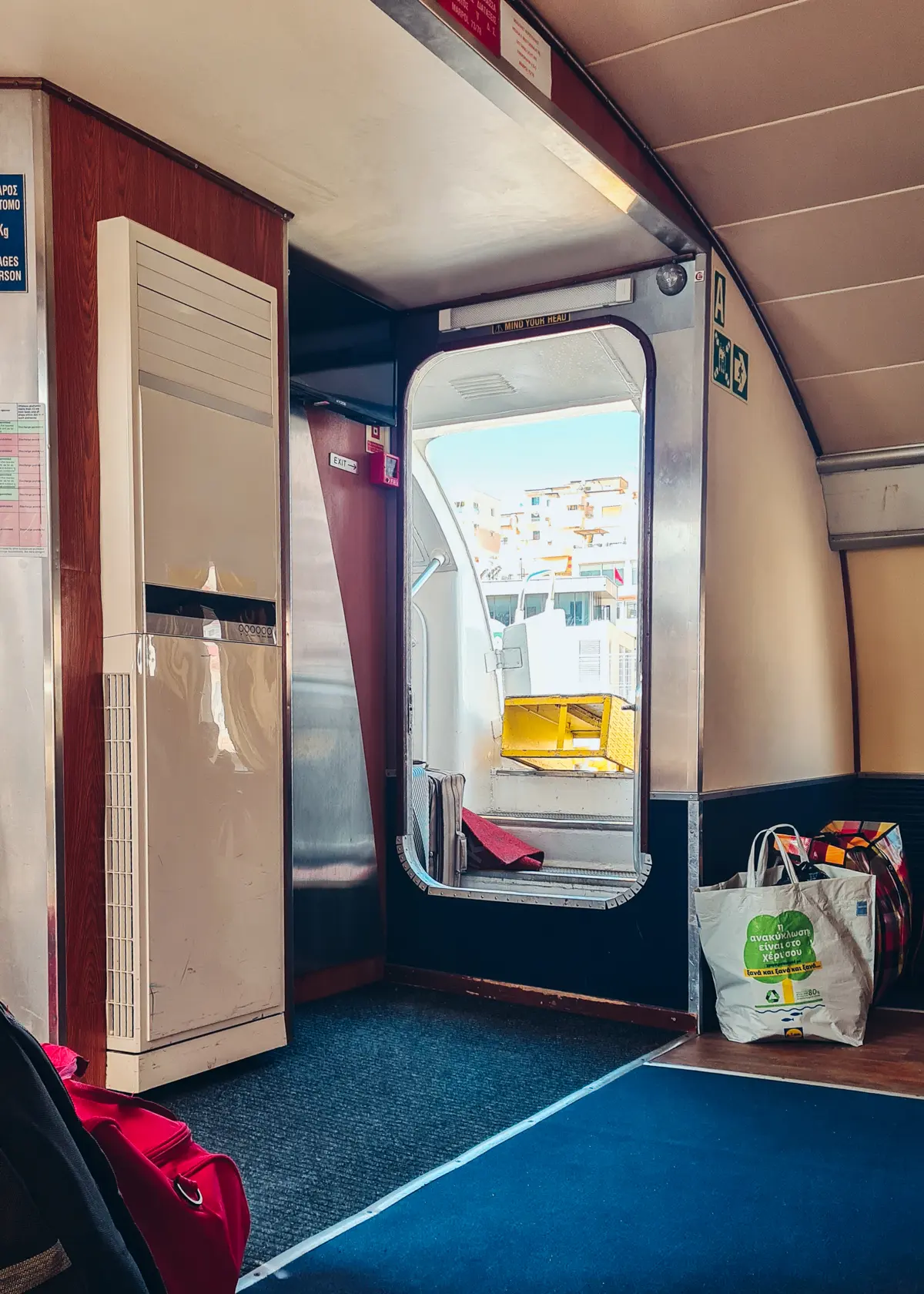 View of an open door from the front seat on Saranda Albania to Corfu Greece Ferry with blue carpet.