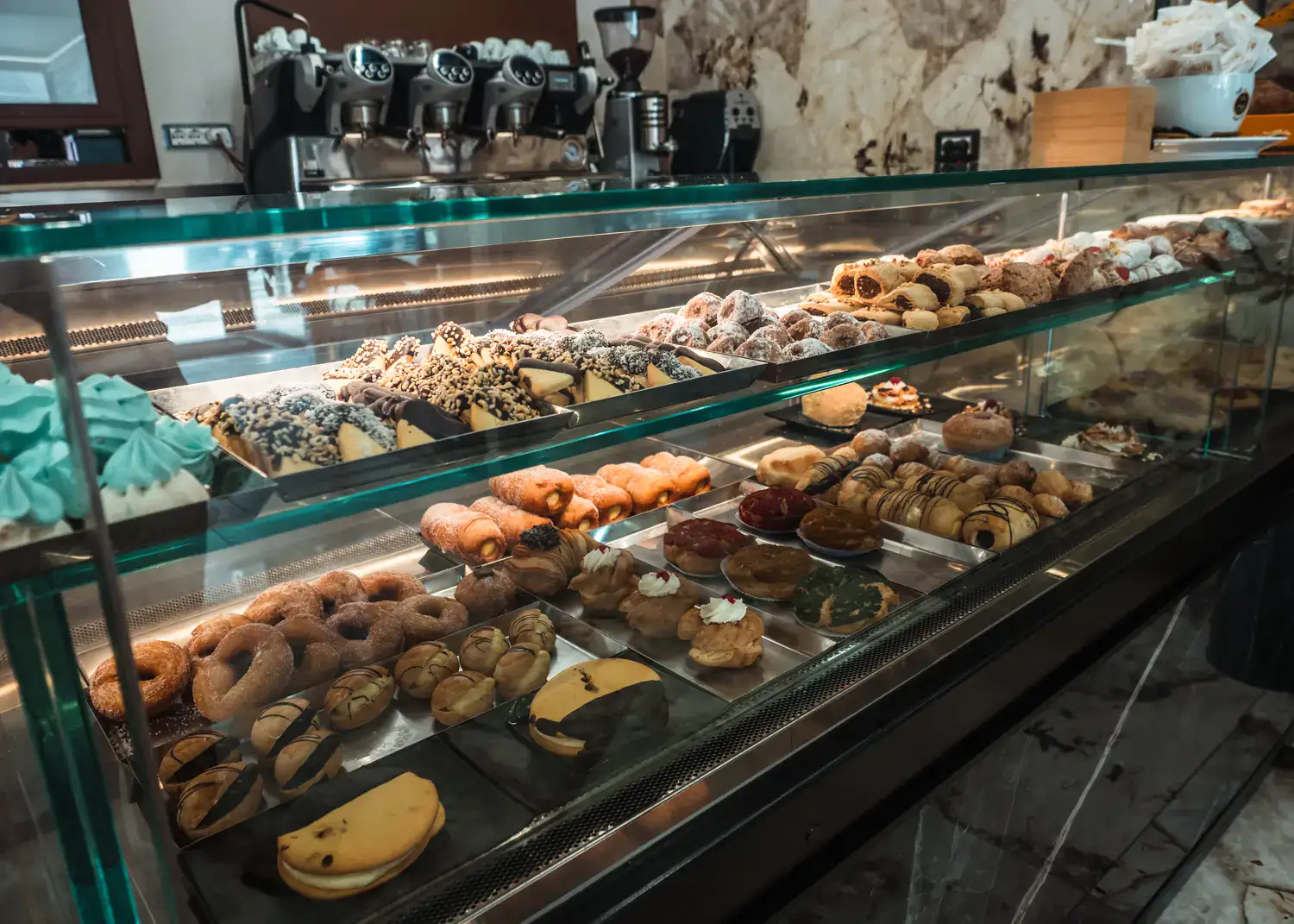 Glass counter full of pastries in Premiata Pasticceria Tropea.