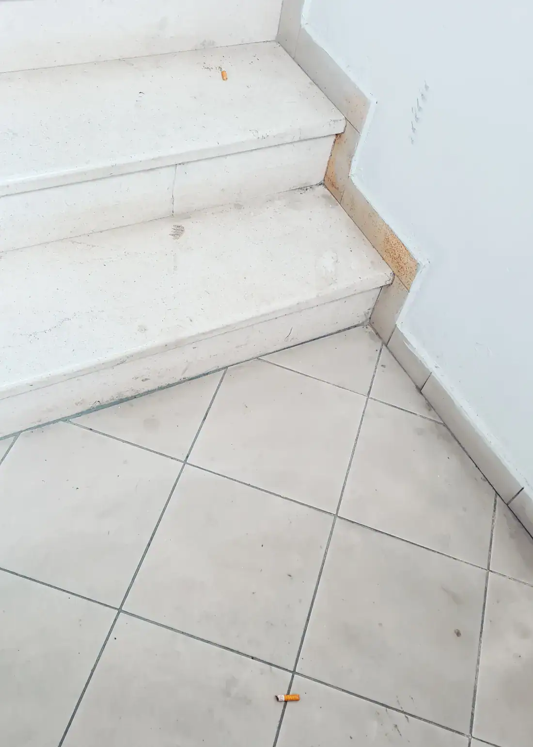 Two cigarette butts on a light staircase in Shkodër Albania, things to know.