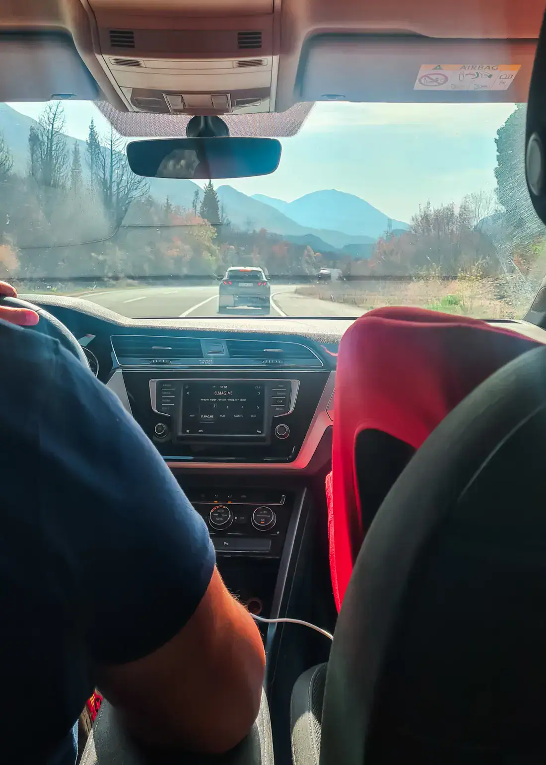 View from the backseat  of a car with a private driver traveling though the countryside from Budva to Tirana.