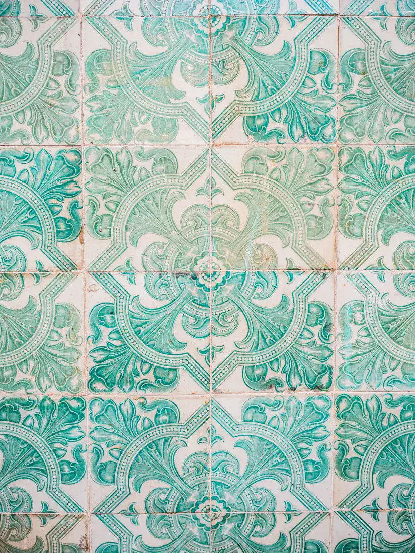Close up of the iconic Portuguese tiles in turquoise and white pattern, seen during the perfect one day in Lisbon.