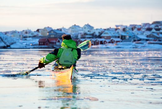 Man kayaking in icy winter sea at Smögen - Photo C
