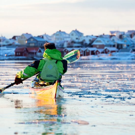 Man kayaking in icy winter sea at Smögen - Photo C