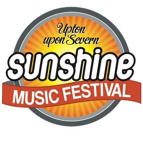Sunshine music festival writing in front of a sun-style logo