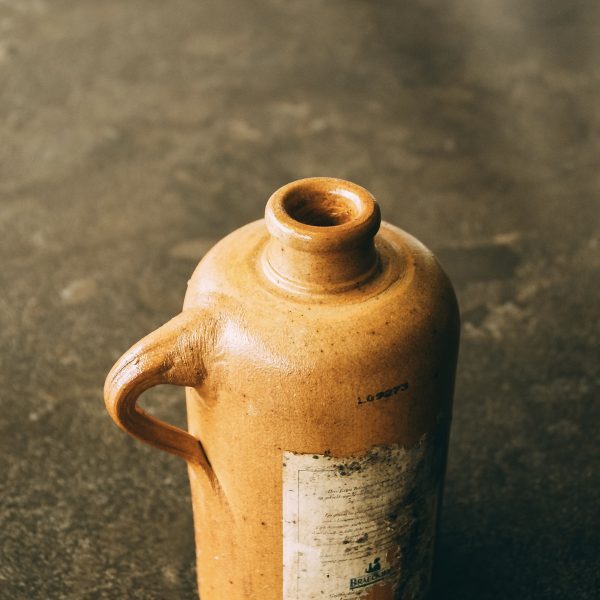 Antique stoneware gin bottle