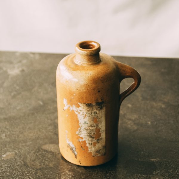 Antique stoneware gin bottle