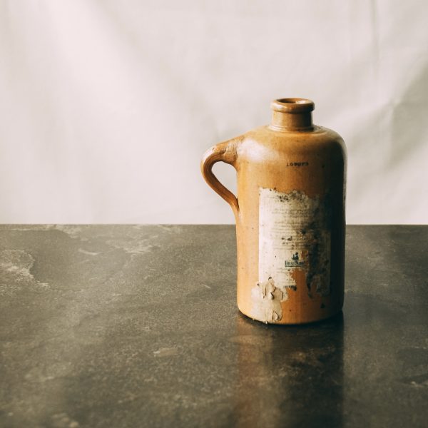 Antique stoneware gin bottle