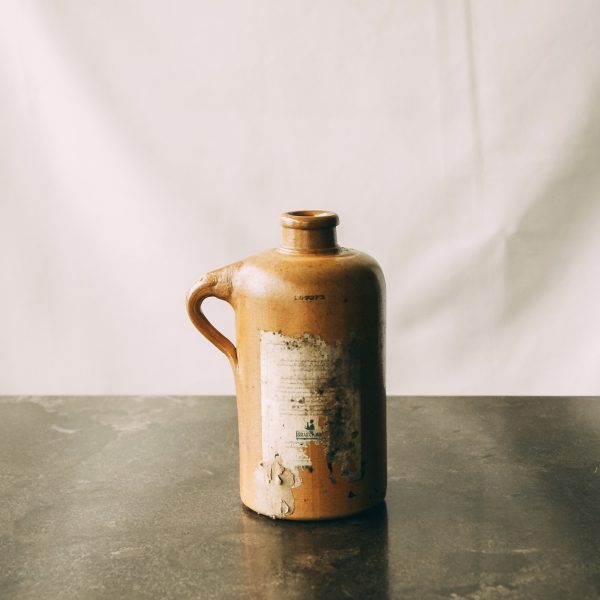 Antique stoneware gin bottle