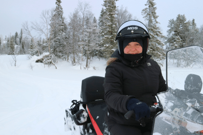 Driving a snowmobile through Västerbotten in Sweden.