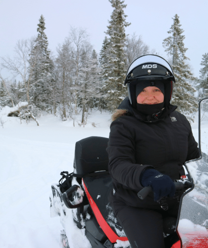 Driving a snowmobile through Västerbotten in Sweden.