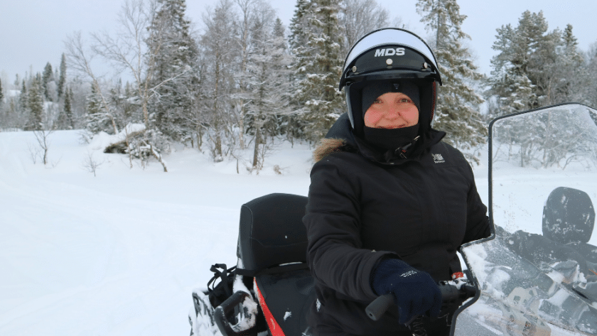 Driving a snowmobile through Västerbotten in Sweden.