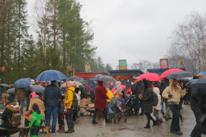 People with umbrellas in Skansen, Stockholm.