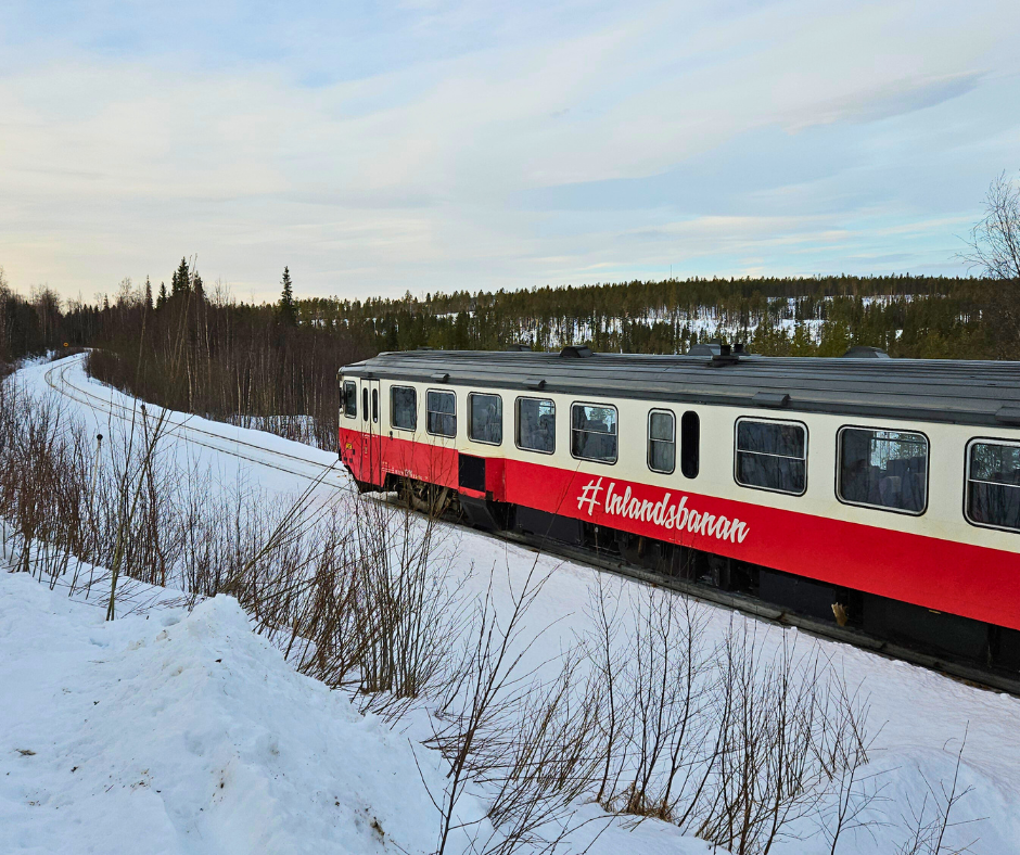 The iconic red train of Inlandsbanan in the snow.