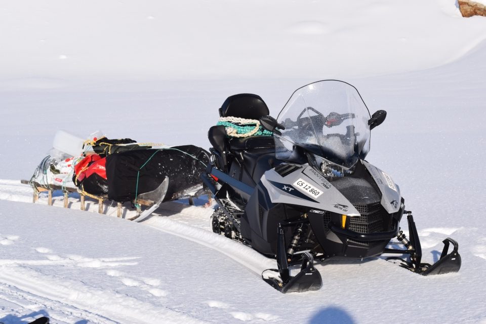 Snowmobile with sled